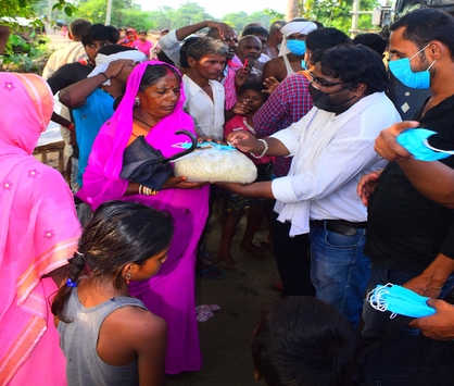 Distributing rations among the needy.